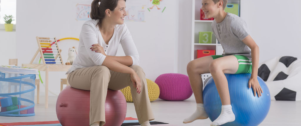 Colorado Counseling Solutions boy sitting on gym ball PKP68SW